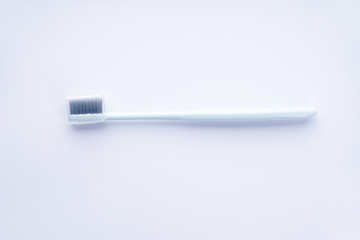 Blue toothbrush in a case on a white background.