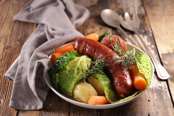 cabbage, carrot, potato with sausage and broth