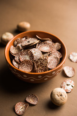 Betel nut chips in a bowl also known as slices of supari in india, used in Paan masala