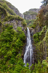 Fototapeta na wymiar Risco waterfall on madeira island, portugal, in the middle of the tropical forest