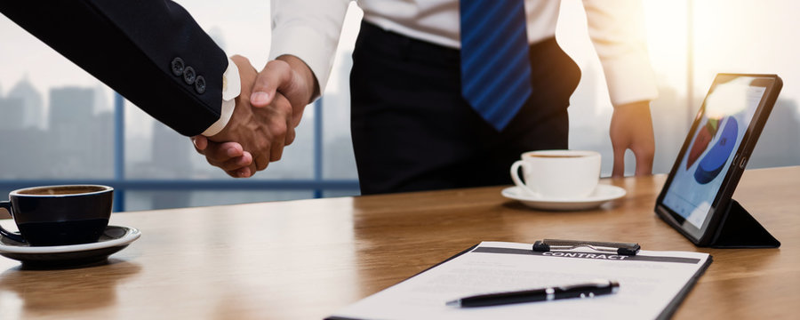 successful negotiate and handshake concept, two businessman shake hand with parthner to celebration partnership and teamwork, business deal.