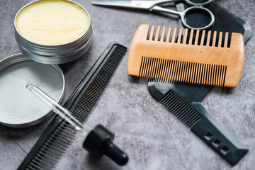 Different combs, brush and other tools for grooming a beard. Close up view.