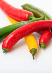 Chili peppers on white background. Vertical portrait