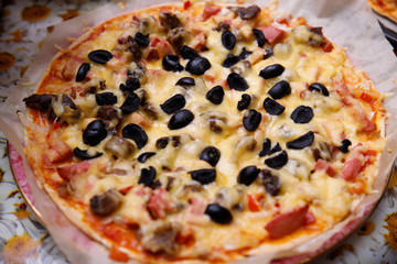 Overhead shot of friends at a table sharing take-away pizzas
