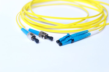 Yellow Fiber Optic cable on white background.