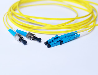 Yellow Fiber Optic cable on white background.