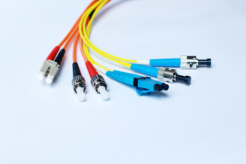  Yellow and Orange color Fiber Optic cable on white background.