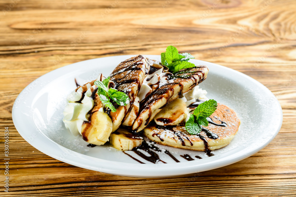 Poster pancake dessert for children with banana and chocolate