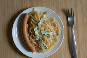 Plate with pasta and sausage