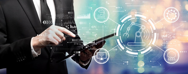 Smart industry concept with businessman using his tablet computer
