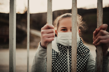Obraz premium Coronavirus and Air pollution pm2.5 concept.Little girl wearing mask for protect pm2.5.Kid girl imprison at home for protection corona virus.Wuhan coronavirus and epidemic virus symptoms.