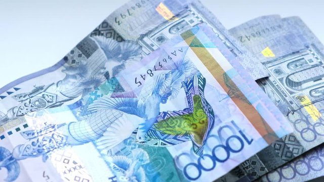 Man counts banknotes of the Republic of Kazakhstan tenge ten- thousandth and twenty thousandth nominale.Slowmo.