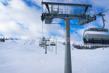 Fototapeta premium Ski slope with ski lifts on the ski resort