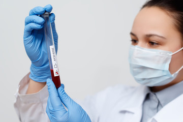 the epidemiologist takes blood tests for coronavirus.