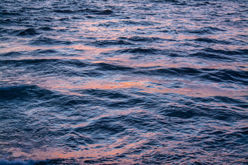 Orange reflections on the sea at sunset