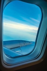 Blue sky seen from an airplane window