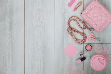Pink flatlay on white wood background. Flat layout. Beauty and fashion