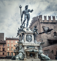 Triton statue under a cloudy sky in Bologna © Gabriele Maltinti