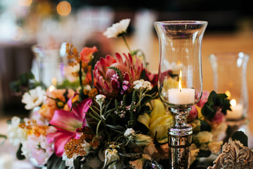 Beautiful, decorated table with flower decorations.  Wedding or party decorations.