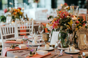 Beautiful, decorated table with flower decorations.  Wedding or party decorations.