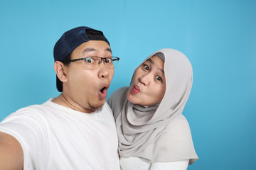 Happy Asian Muslim Couple Making Selfie