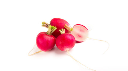 Whole radish and sliced, on white background