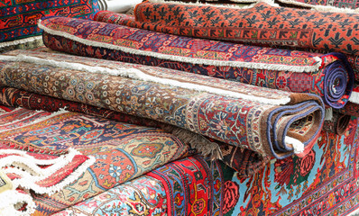 rugs for sale in the market stall on the street
