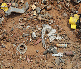 rusty abandoned objects in a dump of ferrous material