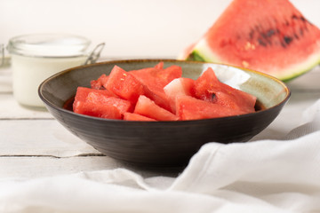 Watermelon fruit cutted in bowl on white background