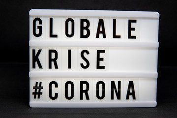 a light box with the inscription: GLOBALE  #CORONA with white background