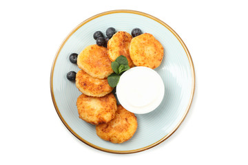 Plate with delicious cheese pancakes isolated on white background