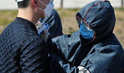 Measuring a body temperature to COVID-19