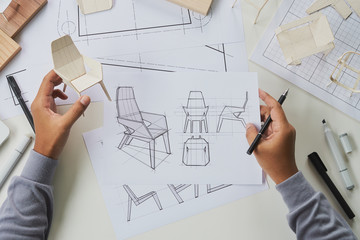 Designer sketching drawing design development product plan draft chair armchair Wingback Interior furniture prototype manufacturing production. designer studio concept .