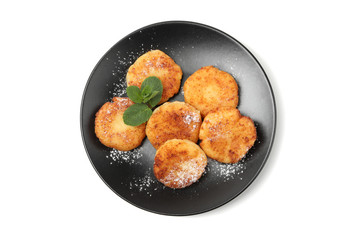 Plate with cheese pancakes and mint isolated on white background