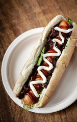 classic hot dog with frankfurter sausage and sauces