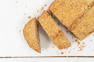 Sliced Bread With Sesame Seeds On The White Wooden Boards