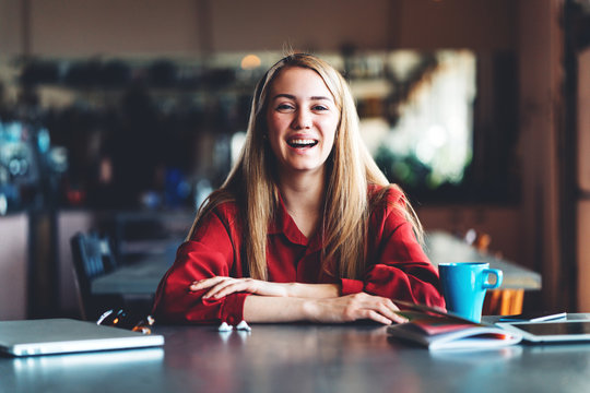 Portrait Of Smiling And Laughting Woman Working In Vintage Coworking Room