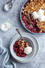 cherry crumble pie served with vanilla ice cream