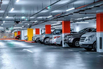 Foto op Plexiglas Headlamp lights with elegant and luxury design. Automotive industry and hybrid car concept. Underground parking © Алексей Закиров