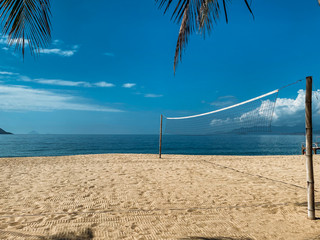 Beach volleyball court on the sandy shore near the sea