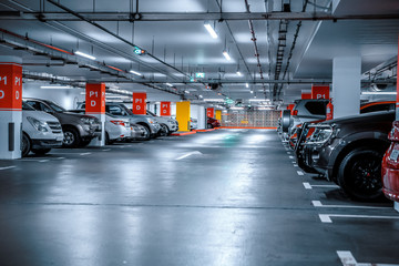 Parking garage - interior shot of multi-story car park, underground parking with cars - obrazy, fototapety, plakaty