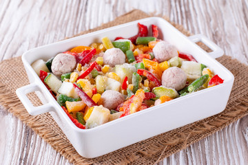 Frozen vegetables in ceramic bowl
