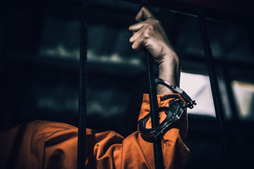 Portrait of women desperate to catch the iron prison,prisoner concept,thailand people,Hope to be...