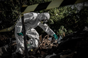 Asian scientist wear Chemical protection suit check danger chemical,working at dangerous zone,Collecting samples in case of Corona virus investigation outbreaked from China.