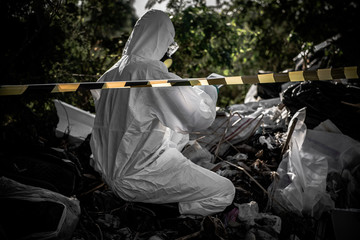 Asian scientist wear Chemical protection suit check danger chemical,working at dangerous zone,Collecting samples in case of Corona virus investigation outbreaked from China.