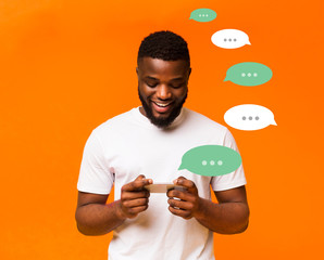 African American man talking in chat on color background, creative collage with space for text
