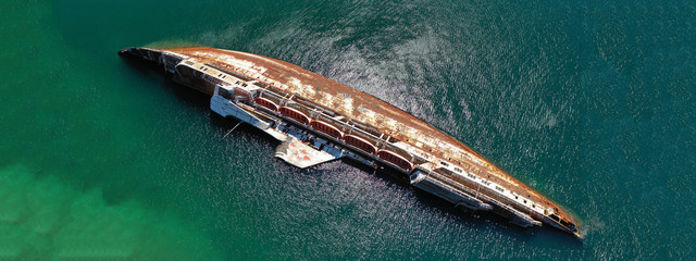 Aerial drone photo of shipwreck passenger ship sunk near shore in Mediterranean sea