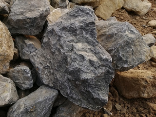 Limestone rock on nature background. Limestone is a sedimentary rock composed mostly of the mineral calcite, It is a basic building block of the construction industry.