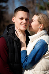 Beautiful young couple in love walks in the park.