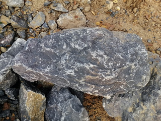 Limestone rock on nature background. Limestone is a sedimentary rock composed mostly of the mineral calcite, It is a basic building block of the construction industry.